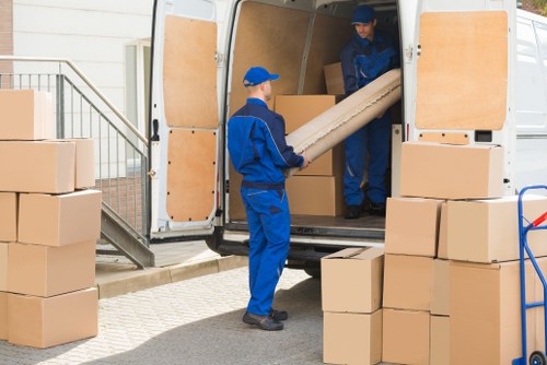 Man With Van Lampton team sorting reusable and recyclable items for a greener move