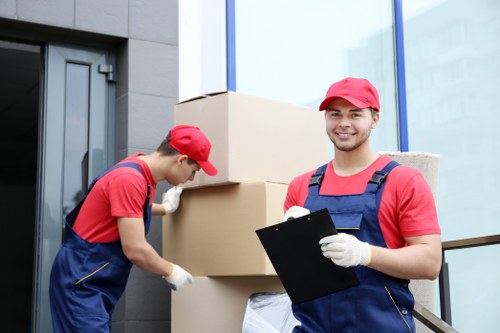 Man and van loading furniture for a local Lampton move