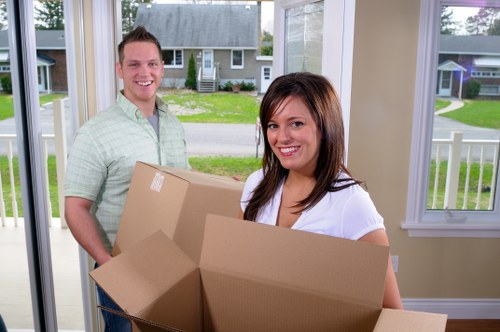 Local moving truck loading furniture in Lampton