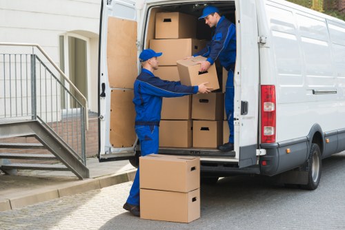 Team safely loading furniture into a van