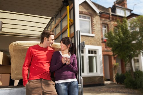 Local van loading sofas and chairs for furniture pick-up in Lampton
